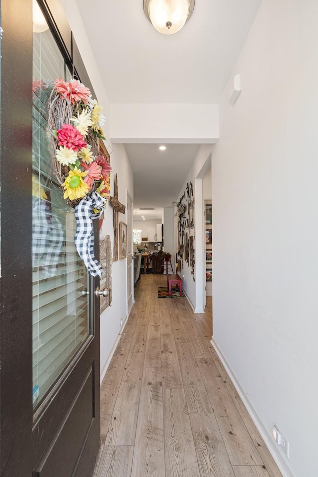 corridor featuring light wood-style floors