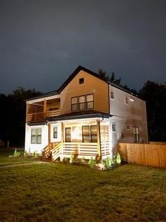 view of back of house at twilight