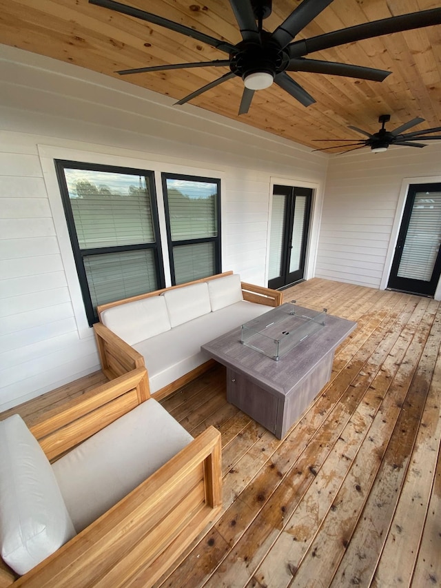 wooden deck with french doors and a ceiling fan