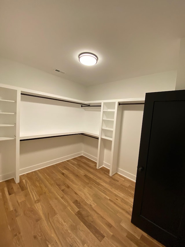 spacious closet with wood finished floors
