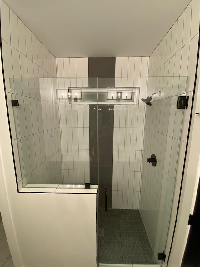 bathroom with a shower stall