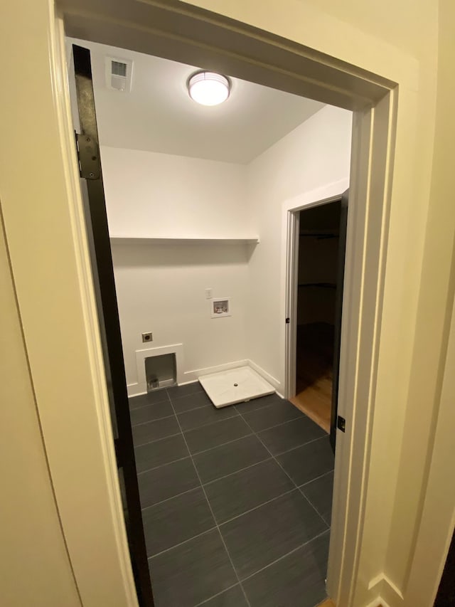 laundry room featuring tile patterned flooring, hookup for a washing machine, and hookup for an electric dryer