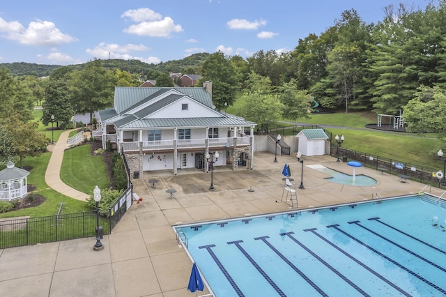 1552 Liberty Pike, Franklin, TN 37067 - back of property with a chimney, a patio area, and a community pool