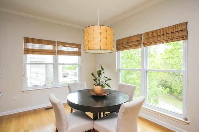 1552 Liberty Pike, Franklin, TN 37067 - dining space with crown molding, light wood finished floors, and baseboards