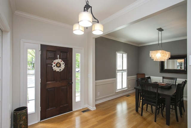 1552 Liberty Pike, Franklin, TN 37067 - foyer entrance featuring light wood-type flooring, ornamental molding, and a chandelier
