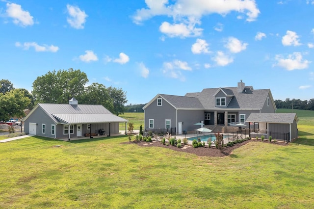 69 Meadows Rd, Hillsboro, TN 37342 - back of property with a chimney, an outbuilding, and a patio area