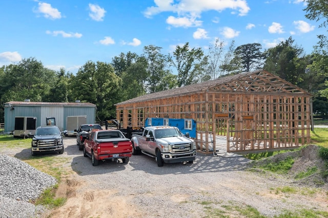 69 Meadows Rd, Hillsboro, TN 37342 - view of parking with driveway and a pole building