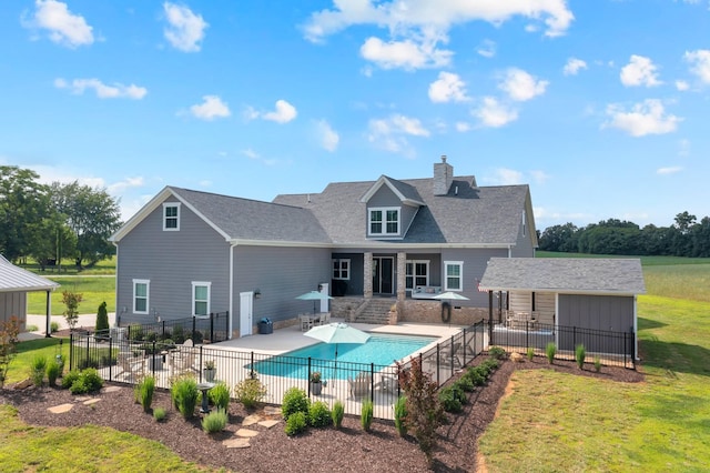 69 Meadows Rd, Hillsboro, TN 37342 - rear view of house with a patio, a chimney, and an outdoor structure