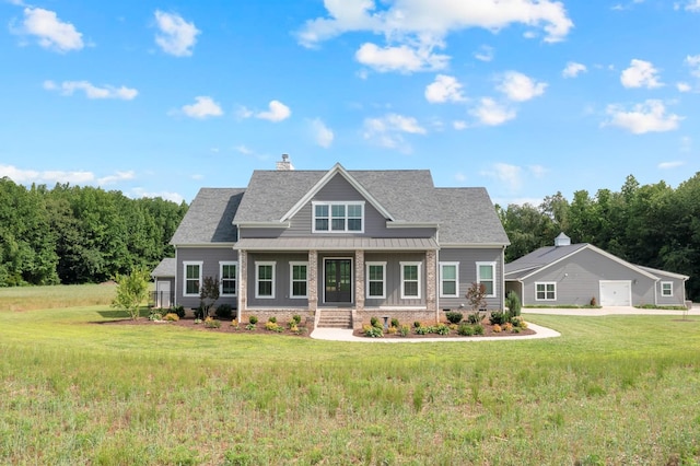 69 Meadows Rd, Hillsboro, TN 37342 - view of front of home with a porch, a front lawn, a standing seam roof, and a chimney