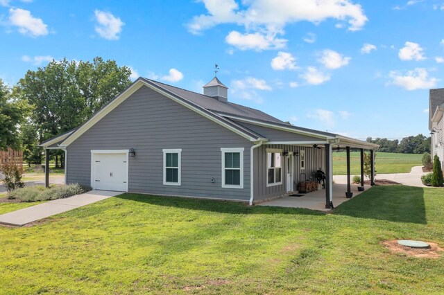 69 Meadows Rd, Hillsboro, TN 37342 - rear view of house with a yard, a patio area, and a garage