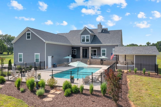 69 Meadows Rd, Hillsboro, TN 37342 - back of property with a patio area, a chimney, and roof with shingles
