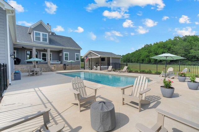 69 Meadows Rd, Hillsboro, TN 37342 - view of swimming pool featuring a patio area and an outbuilding