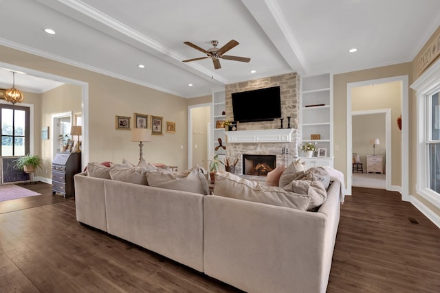 69 Meadows Rd, Hillsboro, TN 37342 - living room with beam ceiling, dark wood-style flooring, a fireplace, ceiling fan, and crown molding