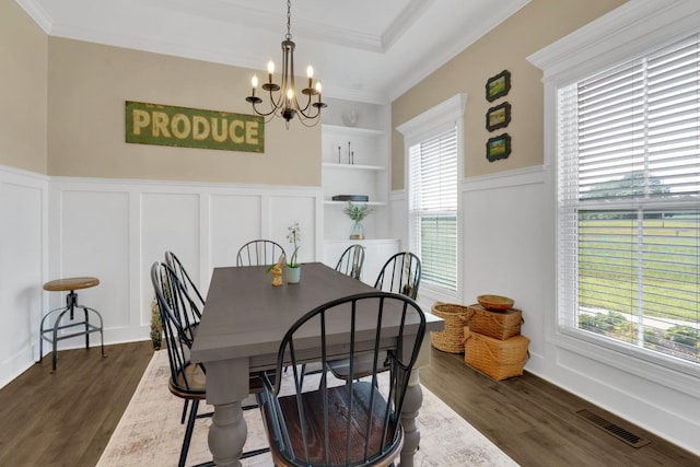 69 Meadows Rd, Hillsboro, TN 37342 - dining area featuring a chandelier, a decorative wall, dark wood-style floors, a wainscoted wall, and ornamental molding