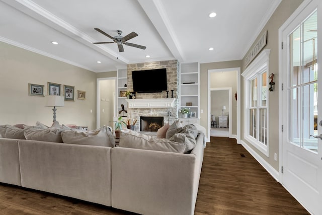 69 Meadows Rd, Hillsboro, TN 37342 - living room featuring beam ceiling, a stone fireplace, ceiling fan, dark wood-style flooring, and crown molding