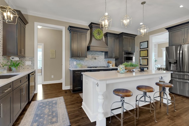 69 Meadows Rd, Hillsboro, TN 37342 - kitchen with stainless steel appliances, custom range hood, a chandelier, backsplash, and crown molding