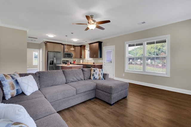 69 Meadows Rd, Hillsboro, TN 37342 - living area with ornamental molding, dark wood finished floors, plenty of natural light, and ceiling fan