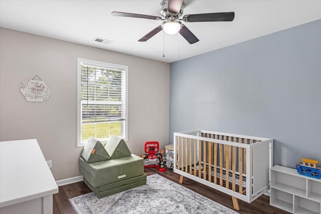 147 Ray Jent Rd, Bethpage, TN 37022 - bedroom featuring wood finished floors, a crib, ceiling fan, and baseboards