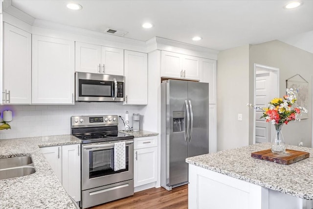 147 Ray Jent Rd, Bethpage, TN 37022 - kitchen with appliances with stainless steel finishes, light wood-style flooring, white cabinets, and recessed lighting