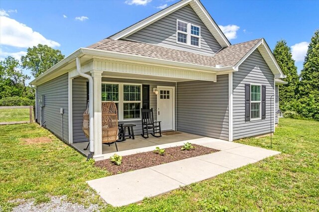 147 Ray Jent Rd, Bethpage, TN 37022 - view of front of property featuring a shingled roof, covered porch, and a front lawn