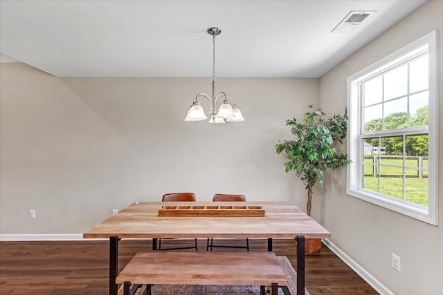 147 Ray Jent Rd, Bethpage, TN 37022 - dining area with baseboards, wood finished floors, and a chandelier