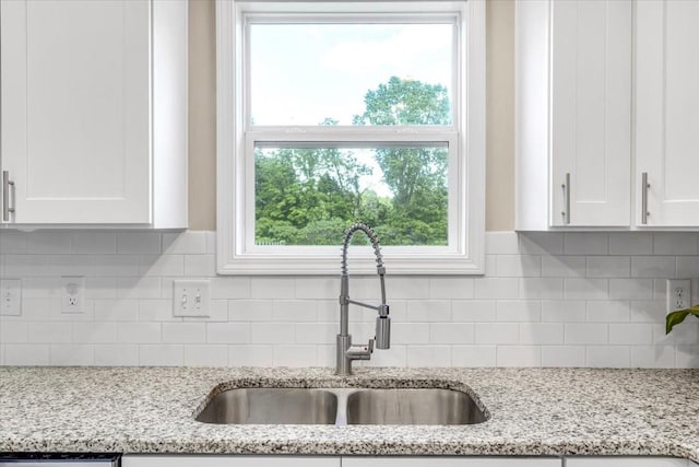 147 Ray Jent Rd, Bethpage, TN 37022 - kitchen featuring a sink, white cabinets, tasteful backsplash, and light stone countertops