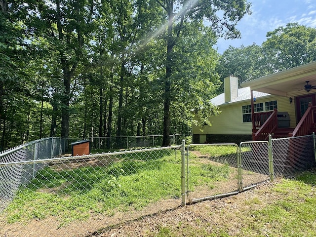 130 Jordan Ln, Hohenwald, TN 38462 - fenced yard featuring a ceiling fan and a gate