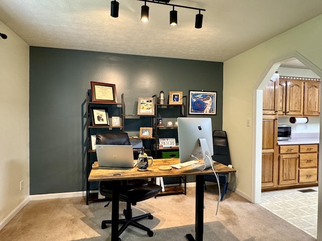 130 Jordan Ln, Hohenwald, TN 38462 - office area featuring light carpet, baseboards, and a textured ceiling