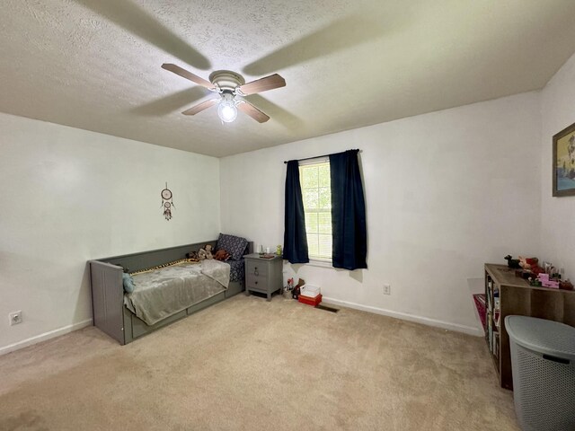 130 Jordan Ln, Hohenwald, TN 38462 - unfurnished bedroom with baseboards, carpet flooring, and ceiling fan