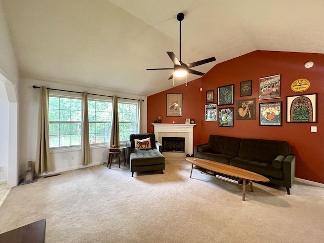 130 Jordan Ln, Hohenwald, TN 38462 - carpeted living area with lofted ceiling, a ceiling fan, a fireplace, and baseboards