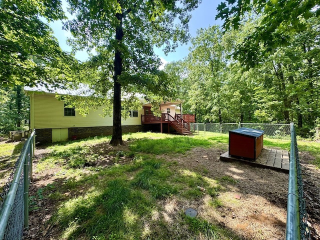 130 Jordan Ln, Hohenwald, TN 38462 - fenced backyard with a deck and stairway