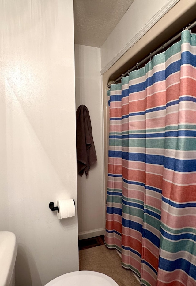 130 Jordan Ln, Hohenwald, TN 38462 - full bath with toilet, a shower with curtain, and baseboards