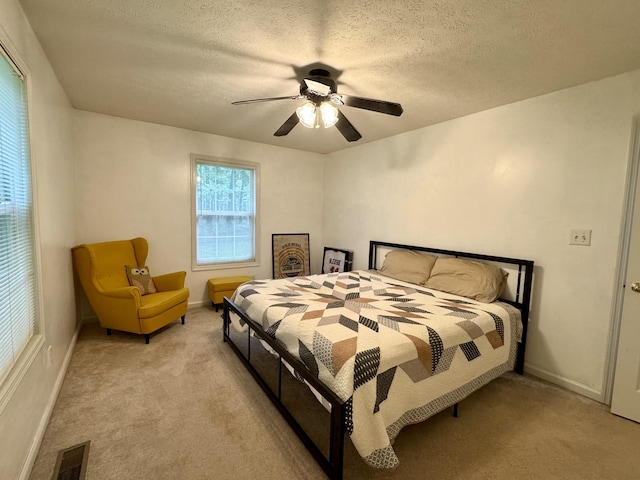 130 Jordan Ln, Hohenwald, TN 38462 - bedroom with light carpet, a textured ceiling, a ceiling fan, and baseboards