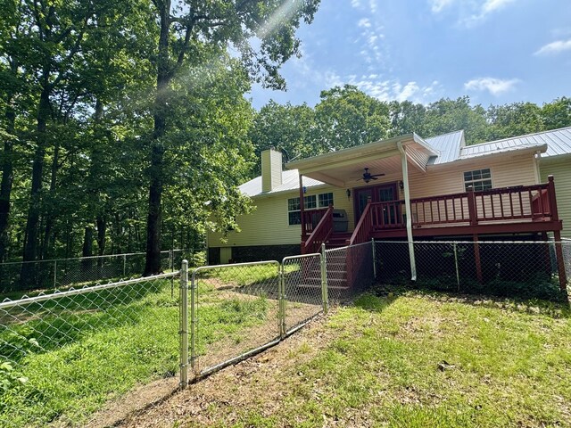 130 Jordan Ln, Hohenwald, TN 38462 - view of front of home with a ceiling fan, stairway, a deck, metal roof, and a standing seam roof