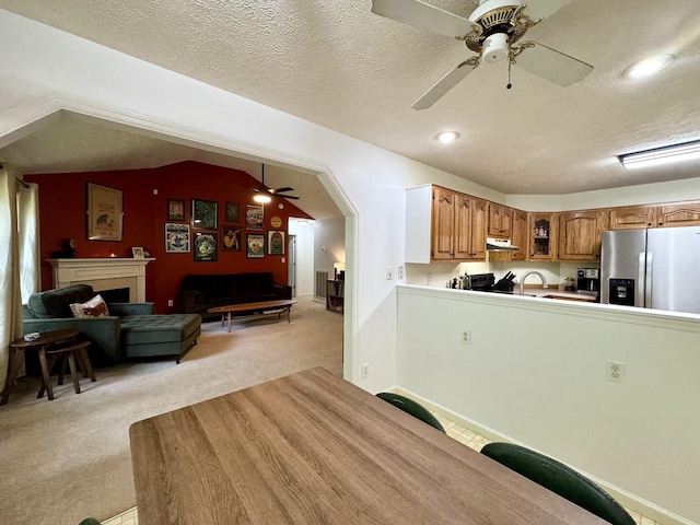 130 Jordan Ln, Hohenwald, TN 38462 - kitchen with stainless steel fridge, a ceiling fan, light carpet, under cabinet range hood, and a textured ceiling
