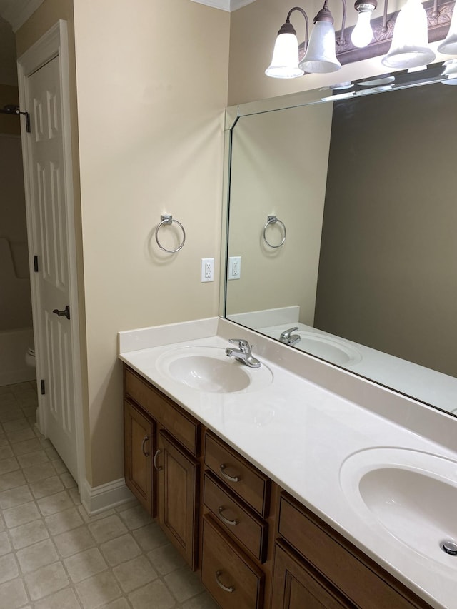 135 Excell Rd Unit 101, Clarksville, TN 37043 - full bath with double vanity, toilet, baseboards, and tile patterned floors