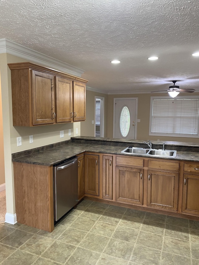 135 Excell Rd Unit 101, Clarksville, TN 37043 - kitchen featuring a sink, stainless steel dishwasher, crown molding, brown cabinets, and dark countertops