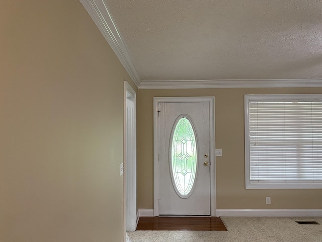 135 Excell Rd Unit 101, Clarksville, TN 37043 - carpeted foyer featuring a textured ceiling, ornamental molding, and baseboards