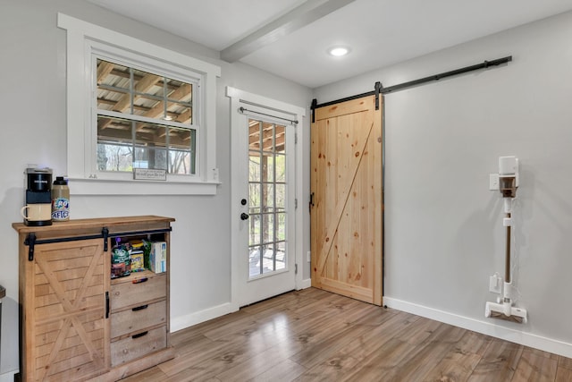 10 Patrick Rd, Fayetteville, TN 37334 - doorway to outside with a barn door, baseboards, wood finished floors, and recessed lighting