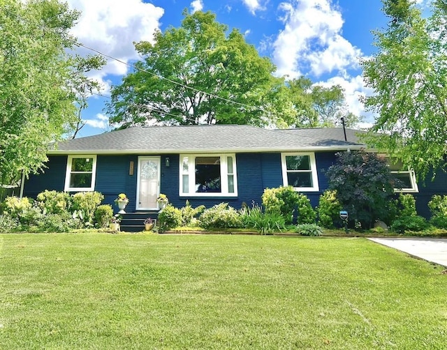 ranch-style house with a front lawn