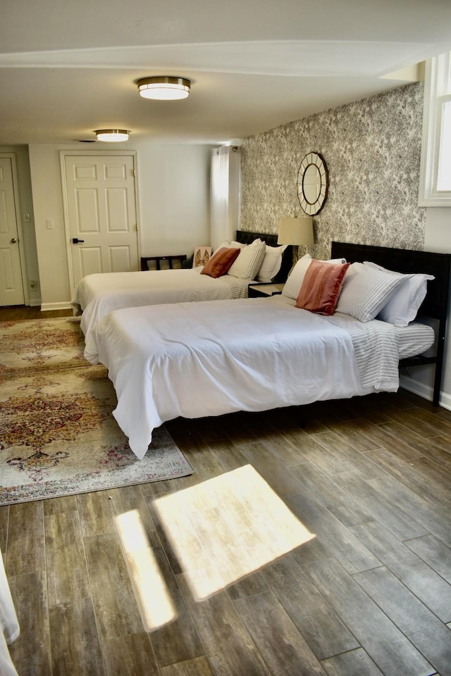 bedroom with wood finished floors