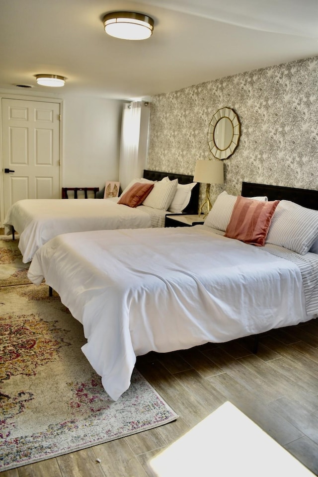 bedroom featuring wood finished floors