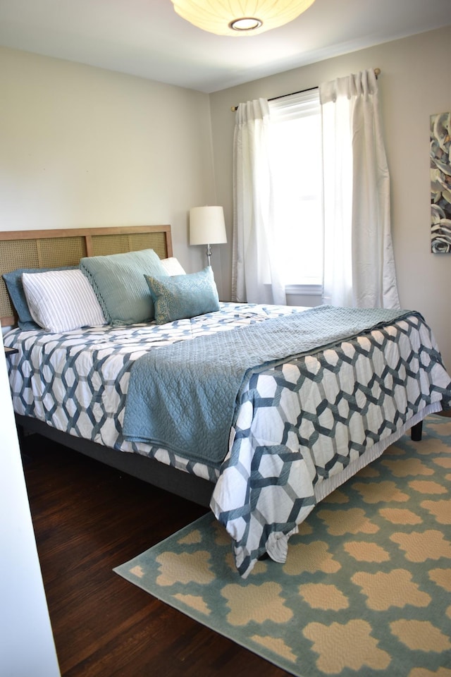 bedroom featuring wood finished floors