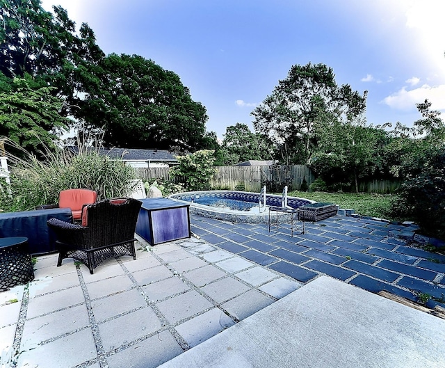 view of pool with a patio and a fenced backyard