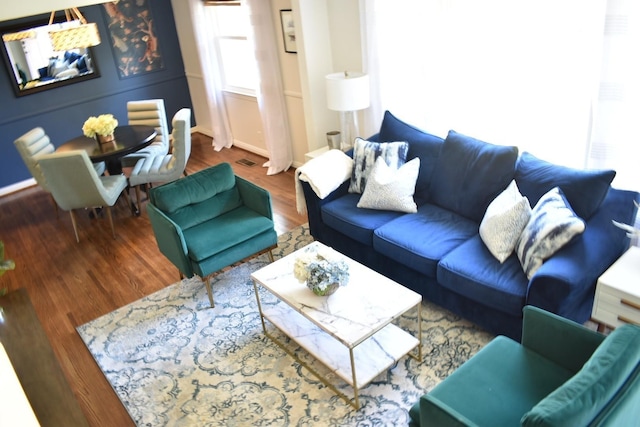 living area featuring wood finished floors and baseboards