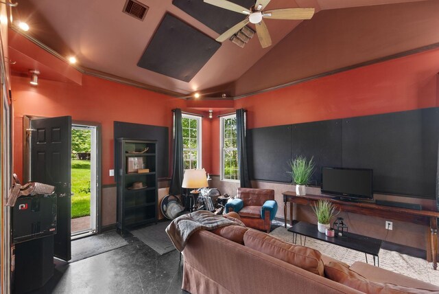 living area with ceiling fan and lofted ceiling