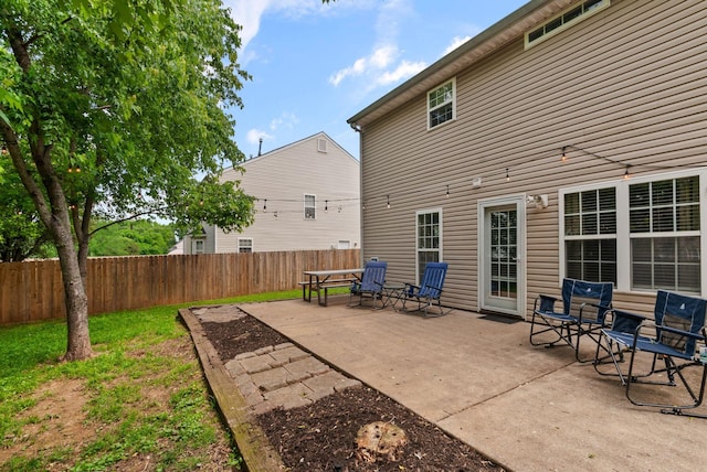 view of patio featuring fence