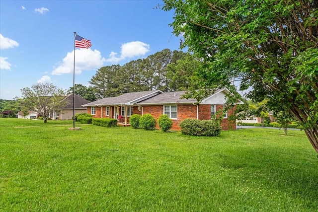 505 Kindel Dr, Decherd, TN 37324 - view of front facade with a front lawn and brick siding