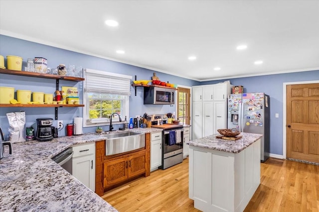 505 Kindel Dr, Decherd, TN 37324 - kitchen featuring stainless steel appliances, a sink, plenty of natural light, light stone countertops, and recessed lighting