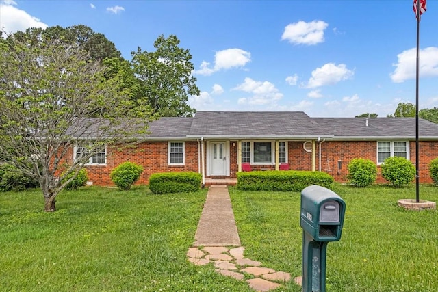 505 Kindel Dr, Decherd, TN 37324 - ranch-style house featuring brick siding, a front lawn, and a shingled roof